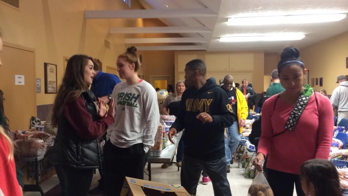 Giving back: Girls basketball players work together on and off the court