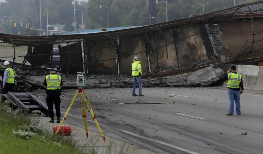  A foot bridge collapsed over the Southfield Freeway in Detroit on Fri., Sept. 26, 2014. A single driver crashed into it. He died after police responders arrived.