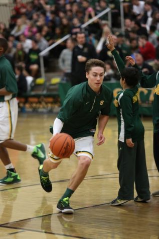 Varsity boys Basketball warms up before their game. They play on Jan. 23 at 7:30 pm against Mason. This is part of the Hoops for Hope event. 