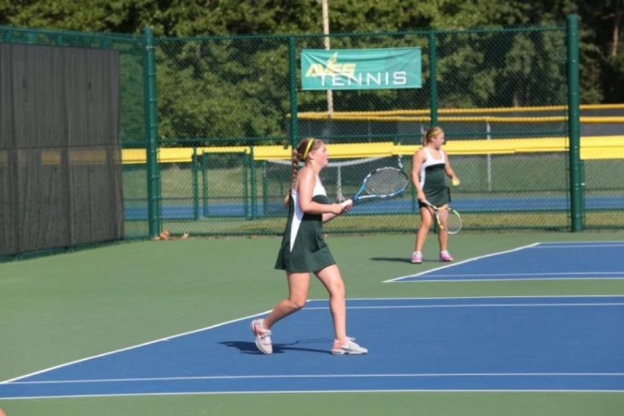 Senior, Jamie Pescovitz steps up to hit a winner return (a really good shot that leaves the opponent unable to return).  After winning the point, Pescovitz exhibits her excitement by exclaiming “Let’s go!”