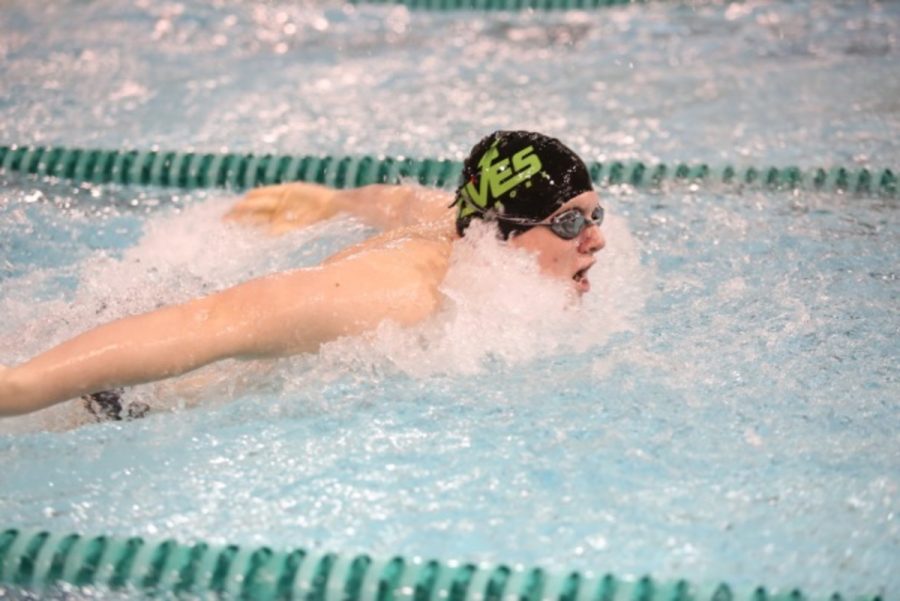 Junior Christopher Seger competes in his primary event, the 100 yard butterfly. Seger is currently ranked 13th in the GMC for the 100 butterfly with a time of :56.93. He will most likely swim a freestyle event along with his 100 butterfly. Photo by McDaniel’s Photography. 