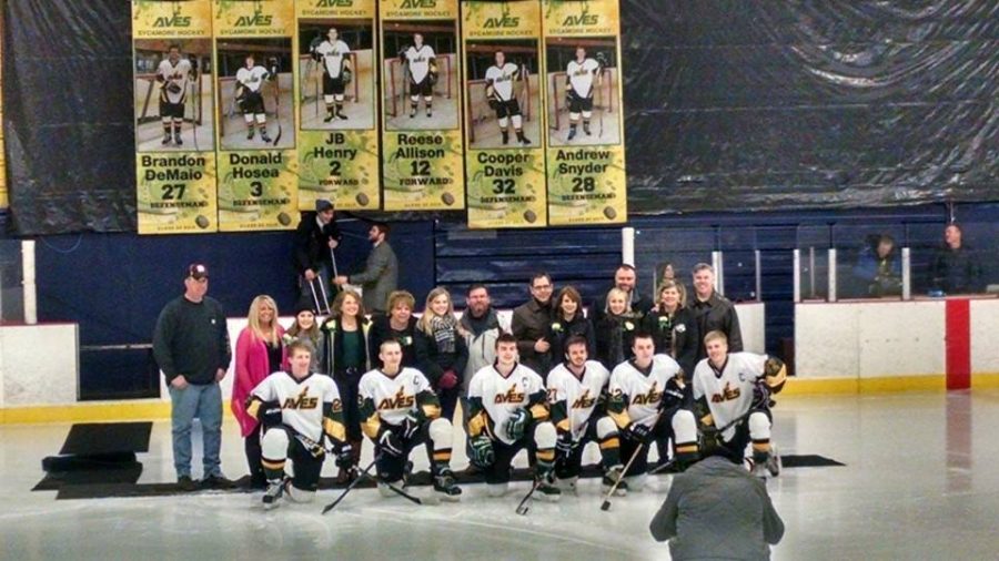 These six seniors were recognized on the ice with their parents.  To celebrate Senior Night, making senior boards and having underclassmen dress in unusual attire is also a tradition.  They are encouraged to wear various suits and outfits that “stand out.” Photo courtesy of Joyce Koehl on Facebook.