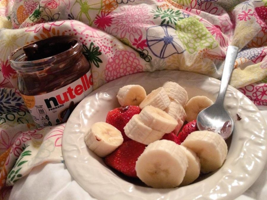 For those who find eating healthy or on a budget  difficult, it is good to keep in mind that its okay to enjoy yourself every now and then as long as it is in moderation. Here a student shows her bowl of fruit accompanied with a jar of Nutella. Nutella is not necessarily the healthiest or cheapest of choices but she only uses a small amount to put on top of her banana slices.