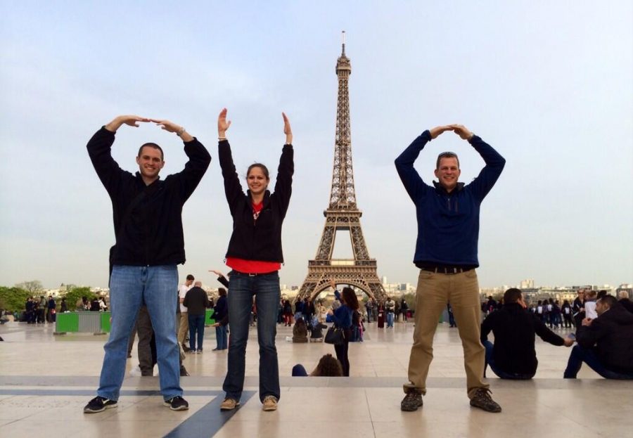 Social studies teachers Andrew Ovington, Jen Hester, and Andrew Ostendorf have fun in front of the Eiffel Tower on last years trip.  The informational meeting for next years trip is on April 14. At this meeting, the new location being added to the trip will be announced.
