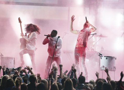 Kendrick Lamar (center), has been one of the most successful rappers in the last year. His album “Good Kid m.A.A.d City” was nominated for rap album of the year at the 2014 Grammys. He also grossed over one million records sold from the album. PC: MCT Photo.