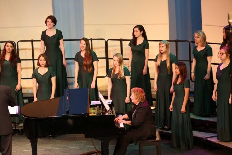 Bella Voce is singing at the spring concert. Mr. Kenneth Holdt directs the whole concert. Choirs sing separately, together, and with numerous instruments throughout the entire choir concert. Photo Courtesy of: McDaniel’s Photography 