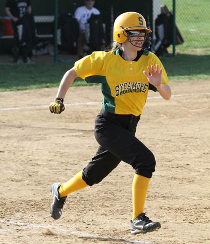 Senior Jordan Schuster runs from home to first after bunting. Schuster plays a variety of positions, including catcher, infield, and outfield. With the loss of several senior players she must step up to fill in this year. Photo Courtesy of McDaniel’s Photography. 