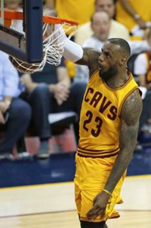 LeBron James slams home a breakaway dunk. James averaged a double-double in points and rebound in the series against the Atlanta Hawks. The Cavaliers will face the winner of the Rockets and Warriors in the 2015 NBA Finals.