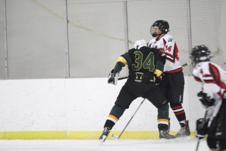 Davis body checks a player from Northglenn. This is a sign of sheer strength and fearlesness. Those are two qualities that are must haves for hockey players.