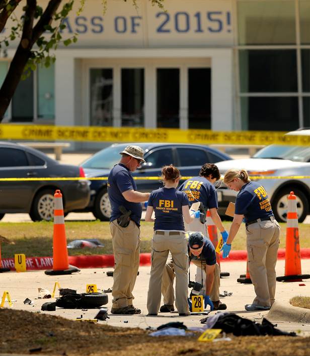 FBI personnel conduct investigations at the Curtis Culwell Center in Garland, Texas where two shooters opened fire on security guards. The shooting occurred at a Mohammed Art Exhibit, which featured cartoon depictions of the prophet and anti-Islam speakers. The center was selected because it had hosted an anti-Islamophobia event in January. .
