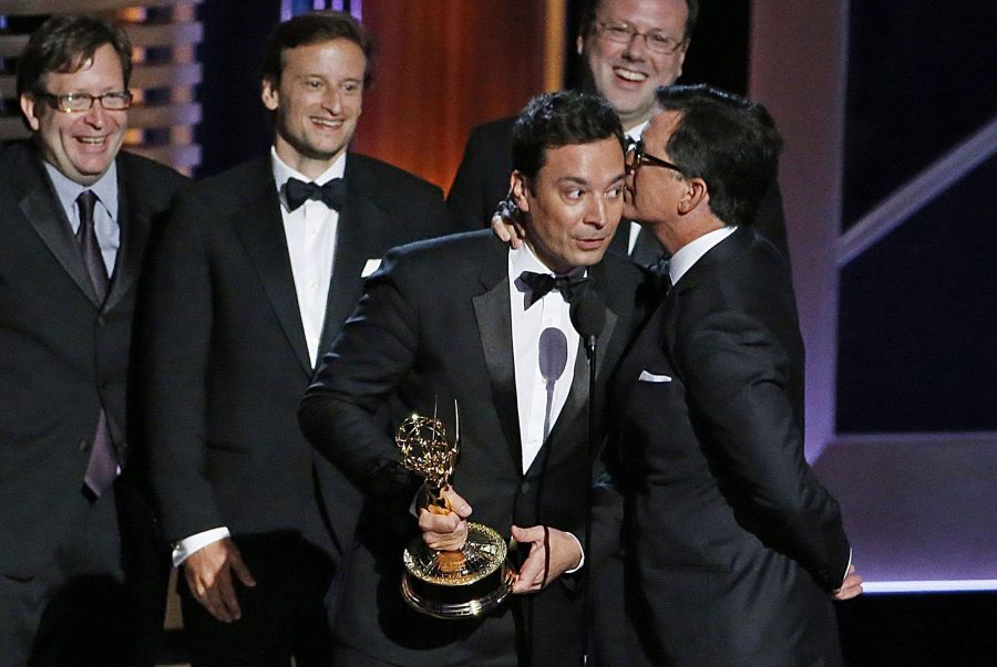Jimmy Fallon host of “The Tonight Show” talks with Stephen Colbert host of “The Late Show” at the 66th Annual Primetime Emmy Awards. While talented, both male comedians have taken over shows for other male comedians (Jay Leno and David Letterman respectively). Other male comedians who have taken over for other male comedians include Trevor Noah, James Corden, and Seth Meyers.