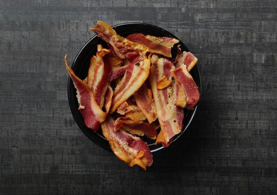 Bacon+has+been+categorized+as+a+Group+1+carcinogen%2C+the+same+category+as+tobacco.+Eating+more+than+two+slices+of+bacon+can+increase+the+risk+for+cancer+by+18%25.+The+link%2C+may+be+found+in+the+iron-based+chemical%2C+heme%2C+commonly+found+in+red+meats.%0A