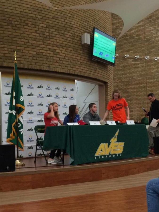 Athletic Director Phil Poggi lead the signing ceremony, which featured the  signings of four student athletes. Over 100 friends and family were in attendance. Senior Mary Fry said “It was really cool to be up on stage with some of my closest friends and seeing all of the people who came to support all of us.”