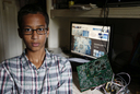 Mohammad poses with his clock. The device closely resembled a bomb. Many famous organizations have shown their support for Mohammad.