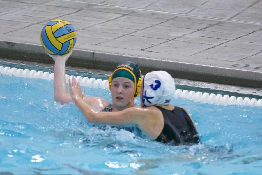    Wessinger looks to make a pass down the pool to assist a shot. Game scores from past games are posted on twitter and it is open to anyone. Click here in order to see the girl’s water polo team’s page. Photo courtesy of sarah Horne
