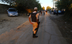 An Egyptian soldier stands on the road as ambulances carry the bodies of the victims from the Russian plane crash. ISIS has claimed responsibility of the crash but the real cause is still being investigated. Possible reasons are: technical difficulties, a fire explosion, or bomb.