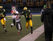 Senior running back Clarence Dawson (1) stiff arms a Princeton defender on homecoming. Sycamore would go on to win the game 33-14 behind 332 rushing yards from junior running back Ra’Von Bonner. Dawson is 67 yards away from having a 1,000 yard rushing season.