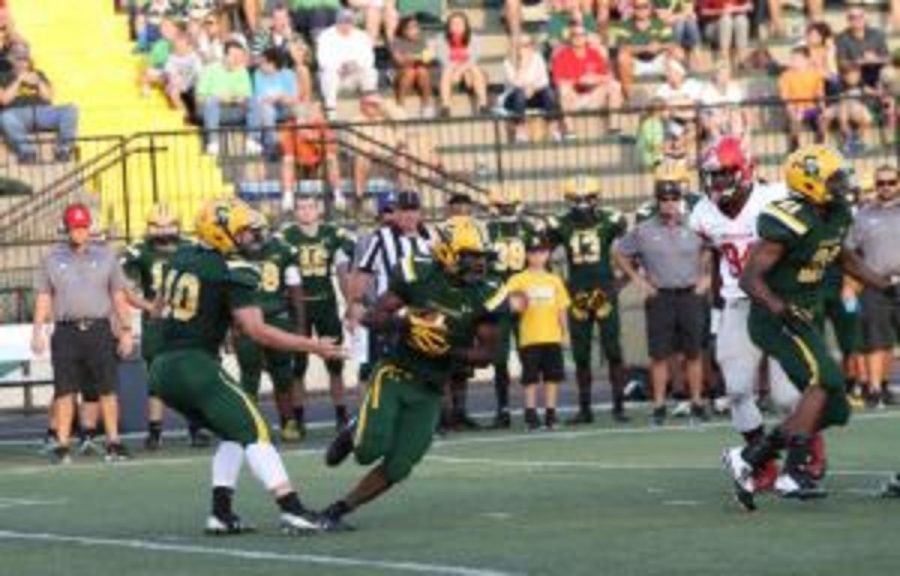 Junior quarterback Jake Borman (10) hands the ball off to senior running back Clarence Dawson (1). After two weeks, the Aves have one win and one loss. Dawson leads the entire GMC in rushing yards.