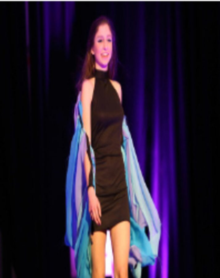 Senior Sophia Weidmann walks the runway at Fashion for         	               the Cure. Students are able to demonstrate their own creativity and illustrate how they have been inspired by the unique work of designers. 
