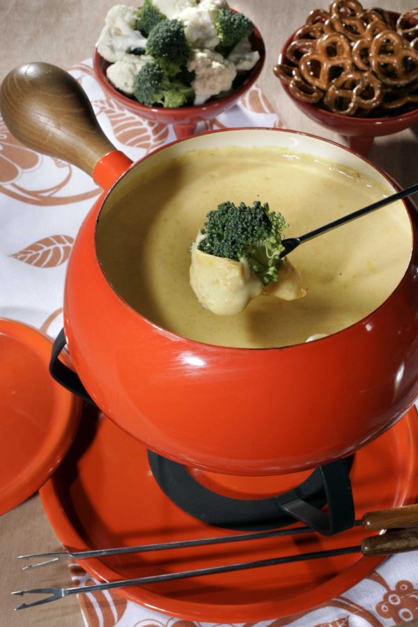 Traditionally, French fondue is a dish that utilizes melted cheese in a communal pot. Food items such as bread are dipped in the cheese and enjoyed by a variety of different cultures like the French, Swiss, and Italian. The dish was finally popularized in North America in the 1930s.
