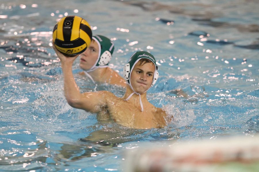 Junior Matt Schuetz winds up for shot during a home game. Schuetz is a starter on varsity. He has been playing since freshman year.