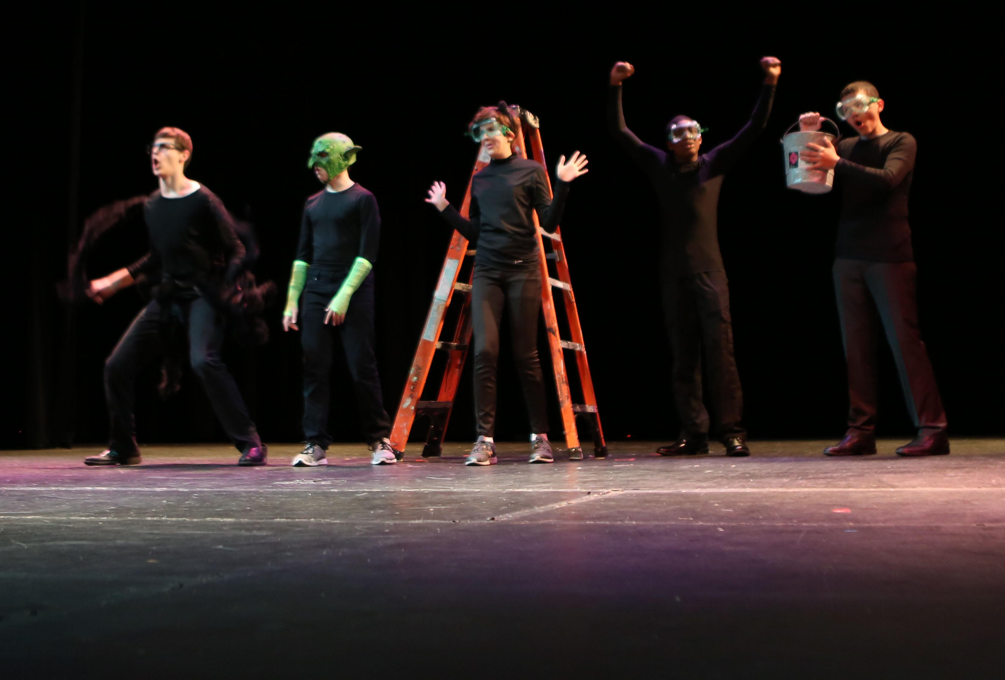 Superheroes save the day in One Act Play
