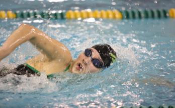 Junior Isabelle Jimenez swims the 200 freestyle at a meet over winter break. The swimmers have 5 more meets this season. The last meet will be the state meet in late Feb.
