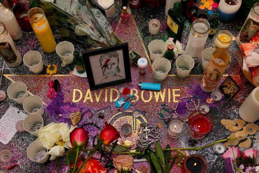 Fans+pay+tribute+to+Bowie+on+Hollywood+Boulevard+in+Hollywood%2C+California.+His+star+on+the+Hollywood+Walk+of+Fame+was+commemorated+with+candles+and+flowers.+His+music+was+played+throughout+the+appreciation+while+fans+paid+their+respects.%0A