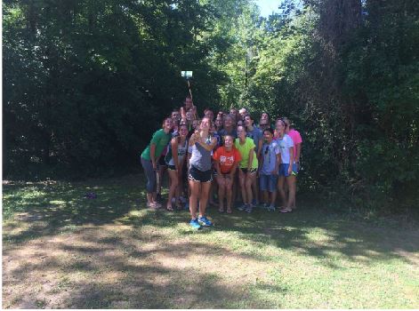The girls cross country team took many selfies on their camping trip. After workouts and swimming they took these pictures to commemorate the trip. Selfies are very popular today.
