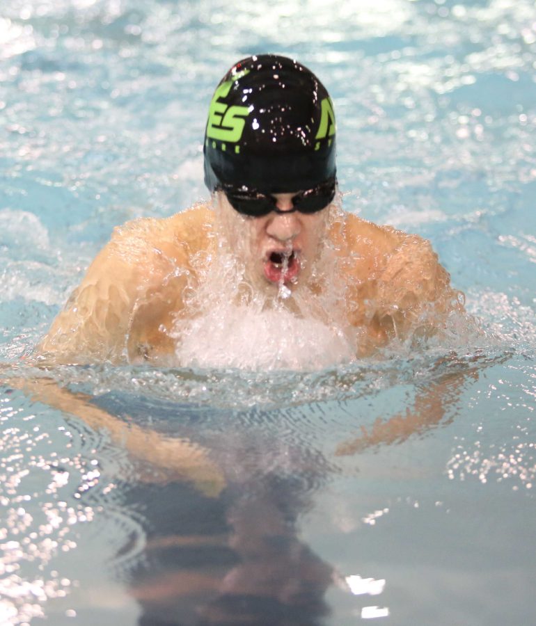 Sophomore Luke Tenbarge races in the 100 yard breaststroke. Tenbarge will taper for the district meet this year. He hopes to make it to state in his individual events as well as on the 200 medley relay. 