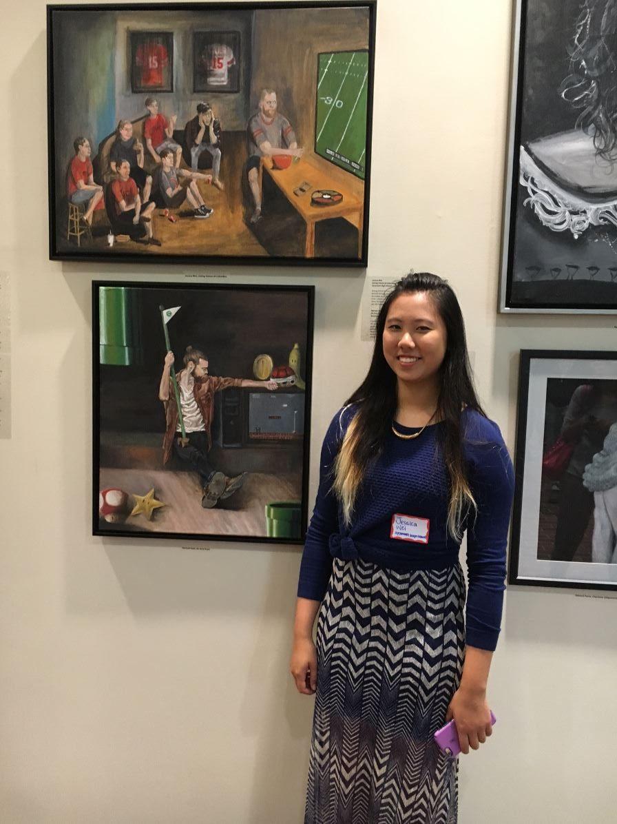 First place winner, Jessica Wei. Her painting is featured above her head to the left. 