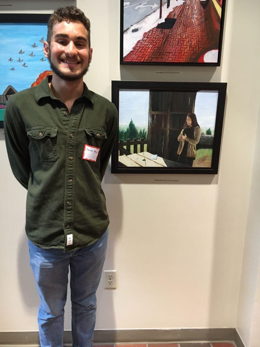 Michael Heyn (12) and his painting of Brooke Baker (11).