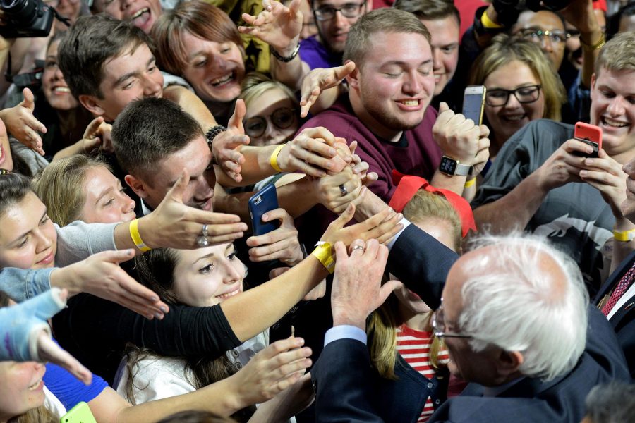 Supporters for Senator Bernie Sanders swarm the candidate at a rally. Sanders has become more of a rock-star as the campaign has gained speed. Unfortunately, this leaves many to pay more attention to the idea of him than what his politics.