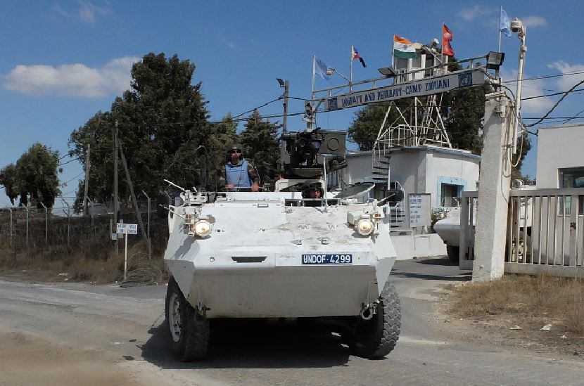 An armored personnel carrier carrying peacekeepers from the United Nations Disengagement Observer Force (UNDOF) leaves the UN military camp. Peacekeepers patrolling in Africa were accused of abuse. United Nations officials opened a meeting to decide on their future actions.