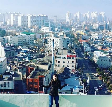 Stephanie Hong traveled to South Korea last year over winter break. While visiting family and touring the country, she discovered the difference between life in America and Korea. Here she stands in a big city in Korea near to the DMZ.