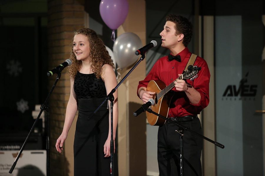 There are solos and groups performing on the stage of the Hub. Freshman Lydia Taylor sings with her brother, senior Alex Taylor. Brothers and sisters sang songs, so did a father and daughter, and a musical group claimed the stage.
