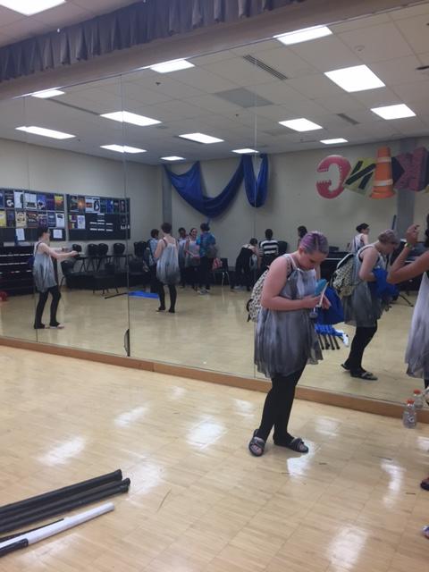 The winter guard groups gets ready for the performance on April 30th. The group practiced and performed in the Little Theatre. The song they danced to was “Falling” by Florence and the Machines. 