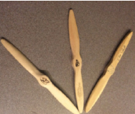 At AirVenture students have the opportunity to carve propellers, build paper airplanes, and enter drawing contests. These propeller was carved by sophomore Sydney Evans in 2010[left], 2009[middle], and her brother in 2008[right]. 
