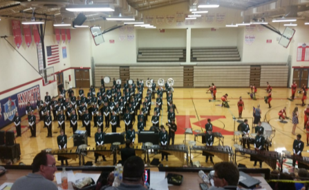 The Sycamore Marching Band ready to perform at their first competition at the King’s High School indoors. The judges sit above the band and wait for the show to start.  The marching band won reserve grand champion. 