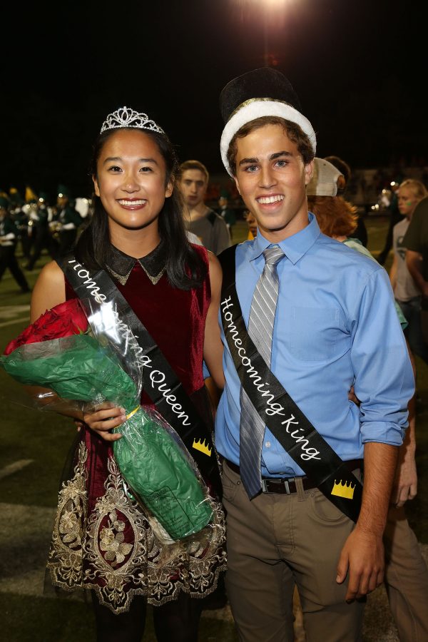 Crowning the Court. Justine Banke (12) and Julia You (12) stand together wearing their new crowns and sashes on Friday October 7th at the Homecoming football game. They were one of three pairs nominated for  homecoming  king and queen. 