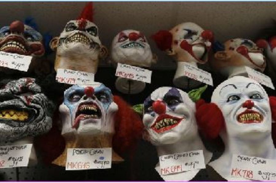 Clowns are buying masks so they can switch them as quickly as possible if noticed. They are a group of middle-aged men and women who think this is funny. They have reeled younger kids into the woods with a trail of candy and money. 