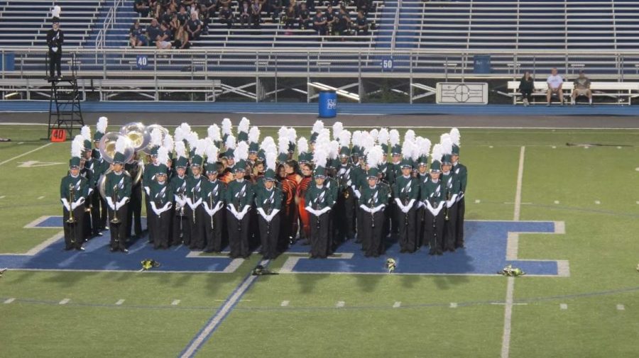  The marching band preforms their show, Vortex on the move for the first time. It was the group’s third competition but due to rain, the other past ones were held indoors, while standing still. The band received third and qualified for state competition.