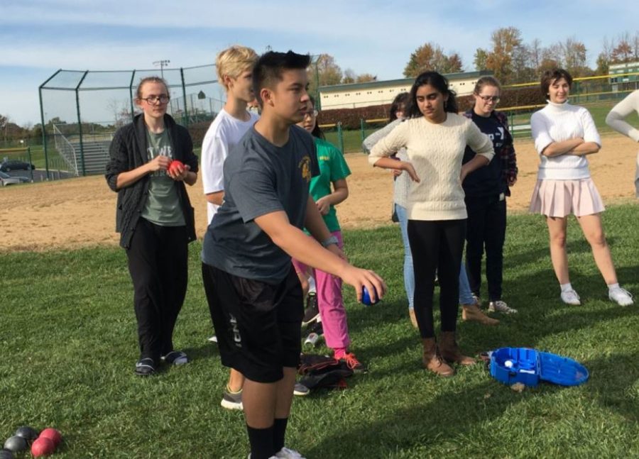 French Club plays petanque on the softball field. Petanque is basically bocce ball, and is very popular in France. Teams compete in rounds until a champion is found. Photo courtesy of Jenna Bao. 

