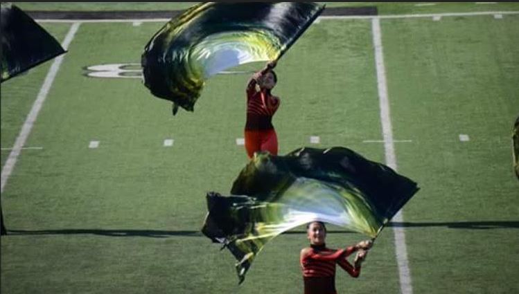PERFORM. From their previous marching band season the members of color guard perform their show, Vortex. Members from the guard meet again after the fall season to help keep their flag skills. Any one is welcome to join the winter spin club, and no experience is needed.