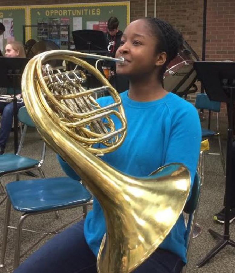 Aria Oliver, 10,  practices her solo piece on her French Horn. She performed the first two movements of Mozart’s 3rd Horn Concerto. This is Oliver’s fourth time participating in Solo and Ensemble. 