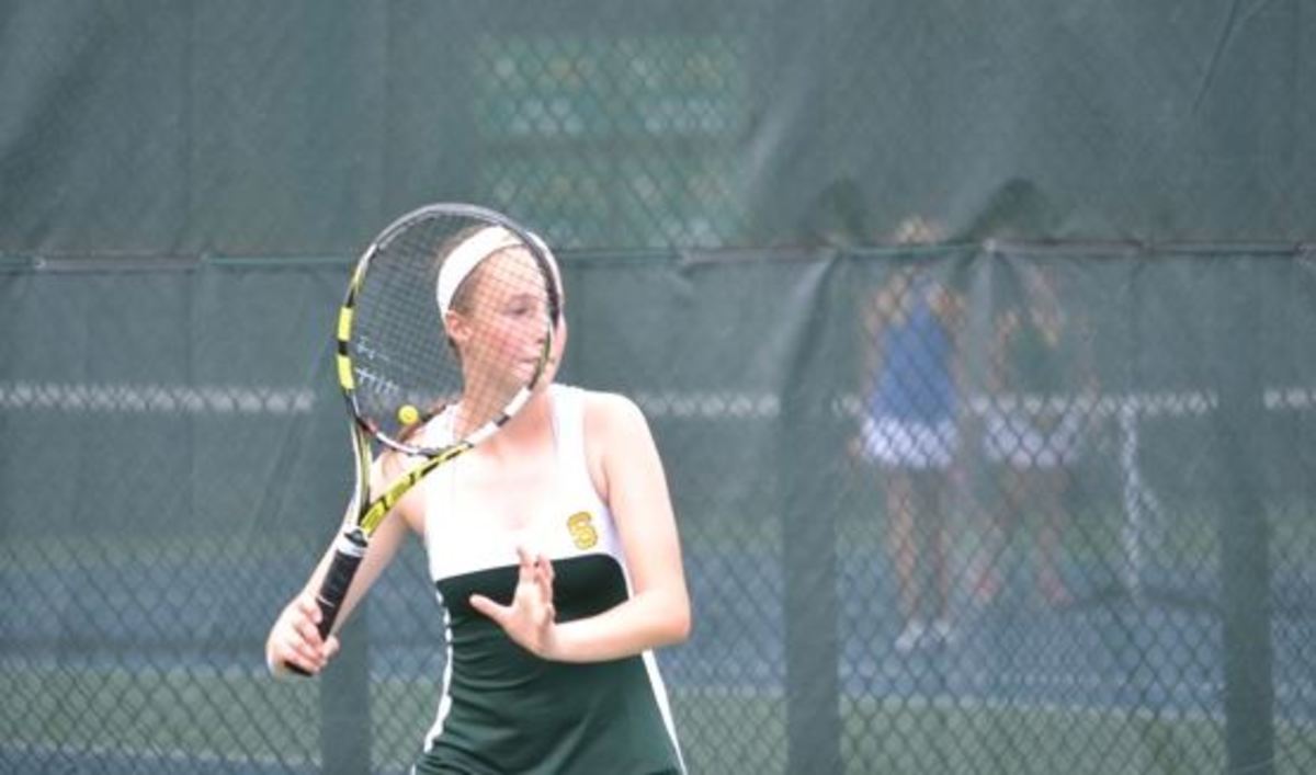 Varsity A girls tennis grinds on the court