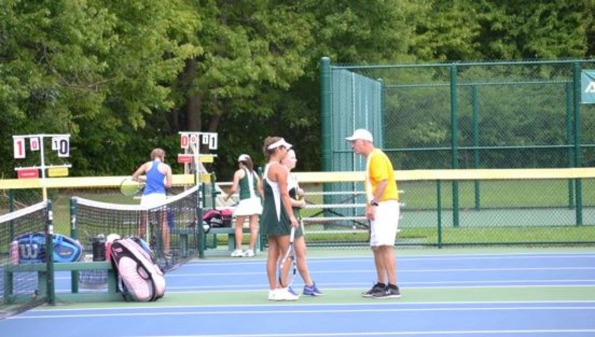 Varsity A girls tennis grinds on the court