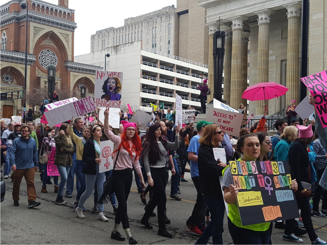 Protesters march in Washington Park on Sat., Jan. 21. The march was meant to be an inclusive, peaceful protest to support  women, the LGBTQ+ community, immigrants, people from different faiths, and many more. Womens marches took place all over the world.