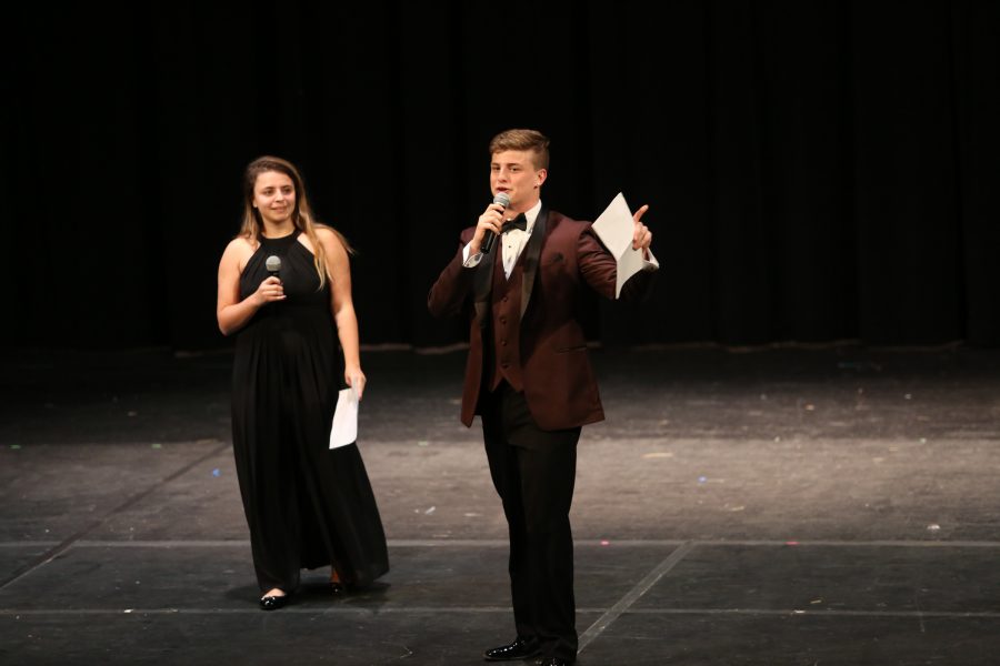 MIC DROP. Seniors Cagla Akcadag and Connor Jarrett hosted Battle of the Sibs as the emcees. Originally, Jarrett was going to be joined on stage by his sister until she became sick on the day of. While participants dressed as outrageous and spirited as possible, Akcadag and Jarrett went for a classier look.