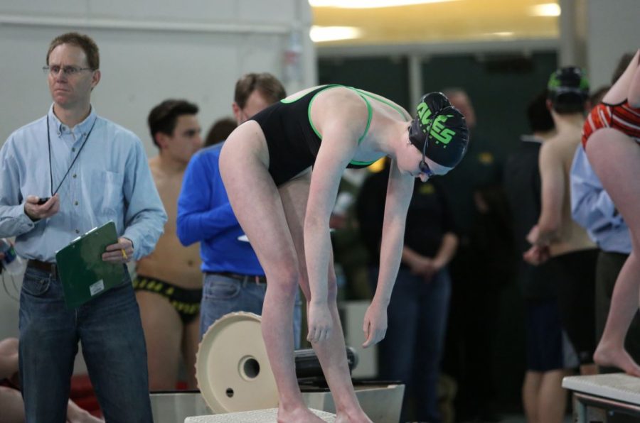 Junior Madison Forsthoefel prepares for her 200 freestyle at a meet earlier in the season. Foresthoefel will swim the 200 IM and the 200 freestyle at GMC’s.  This is her third year on the team.